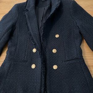 An elegant and versatile tweed very dark navy blazer